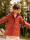 BRICK-RED HOODED RAINCOAT WITH SHINY PANTHER PRINT