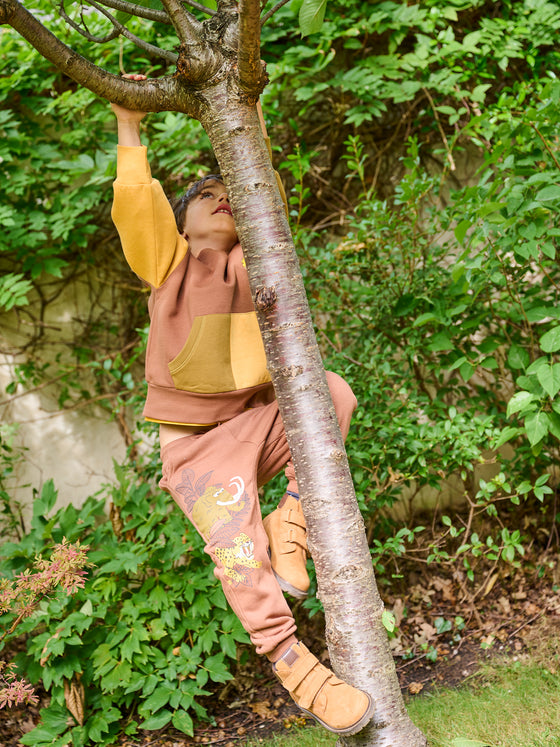 Bark jogging suit with prehistoric motif