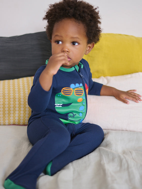 Baby boy midnight blue romper with dinosaur motifs