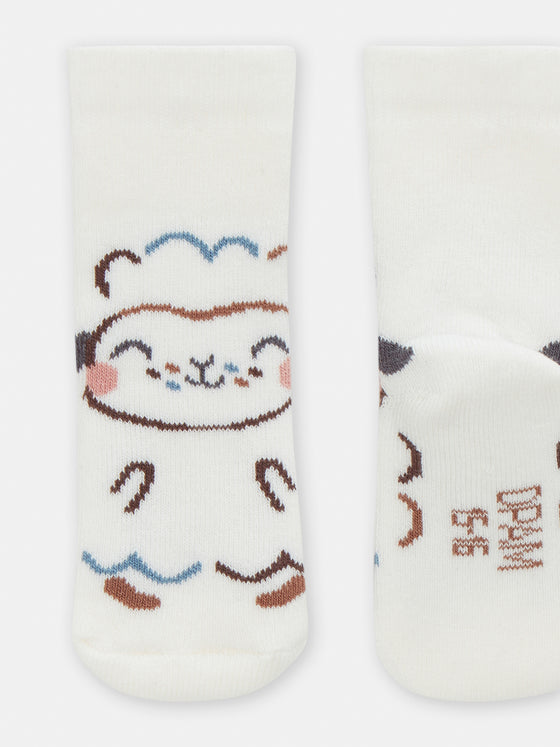 Ecru birth socks with sheep animation