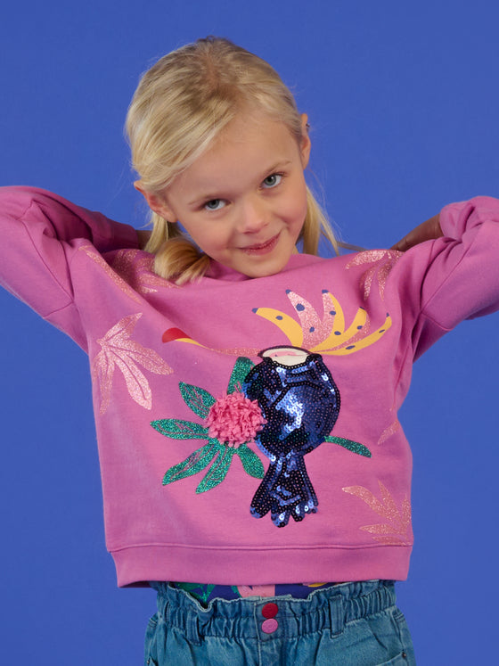 Pink blouse with sequined parrot